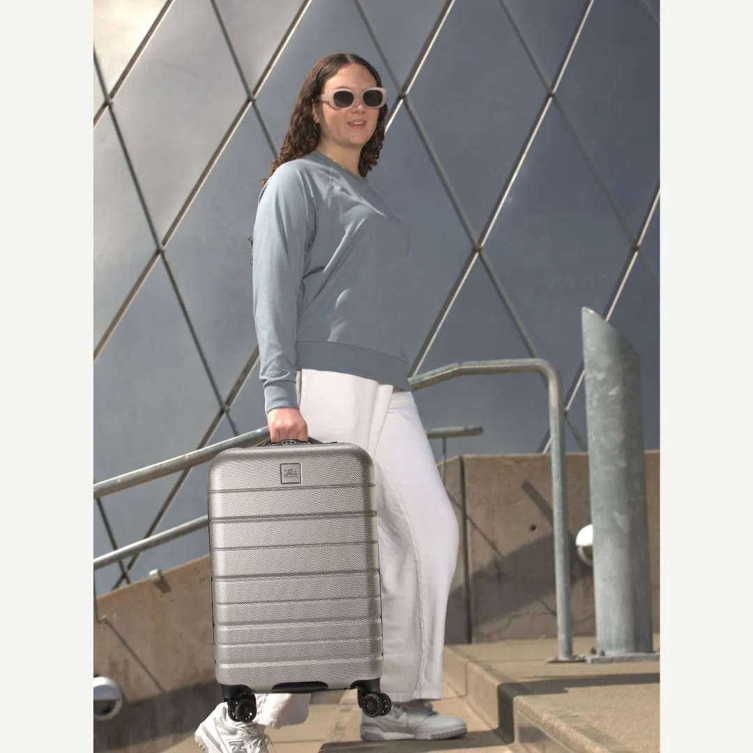 Skyway Epic 2.0 Hardside Lightweight and Durable ABS Shell Luggage, Spacious with Dual Spinning Wheels, Comfort Grip, Men and Women, 28-inch Large Check-In, Bone